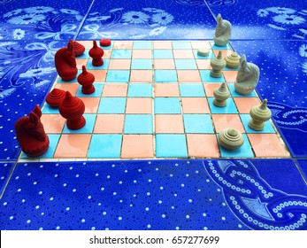 Chess on the tile Table.