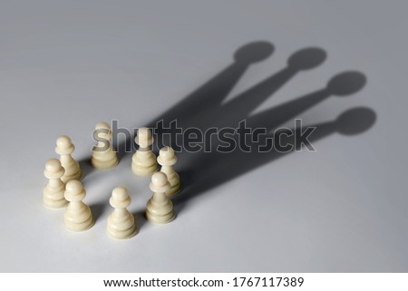 Chess pawn circle with shadow shaped as a crown