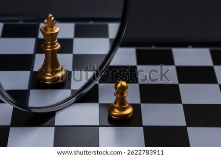 Chess pawn looking its reflection on a mirror and seeing itself as a King, Think Big.