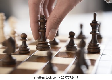 Chess piece Lady. Female hand player girl holds a lady chess piece in the air. Wooden chess piece. Chess board party
    - Shutterstock ID 2097272449