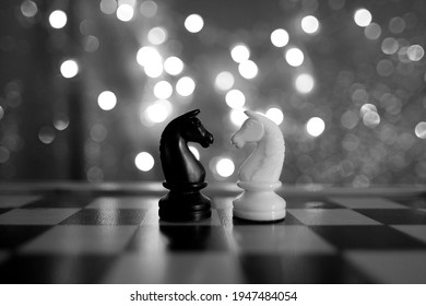 Chess Pieces, Horse, White And Black On A Chessboard, Concept Of Leadership And Teamwork In Business, Duel, Opposition Of Light And Dark Forces, Sports Game