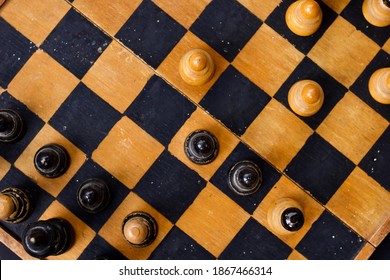 Chess Pieces On Old Vintage Wooden Used Chess Board, Game Of Checkers, Flat Lay