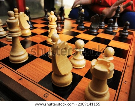 chess pieces on a table in the park