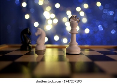 Chess Pieces, Queen In The Royal Crown, Horse, King, White And Black On A Chessboard, Concept Of Leadership And Teamwork In Business, Duel, Opposition Of Light And Dark Forces, Sports Game