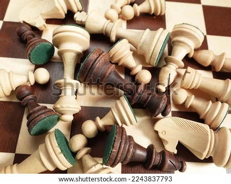 Chess pieces are scattered on the chessboard. Banner for advertising a chess school close up