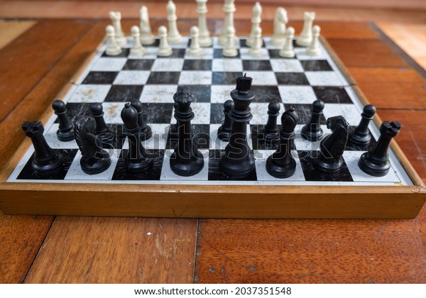Chess is a\
two-person strategy game played on a chessboard consisting of 64\
squares, arranged in 8 × 8 squares, which are equally divided (32\
squares each) into white and black\
groups.