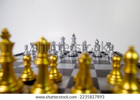 Chessboard close-up, matchup start of game, selective focus, white background