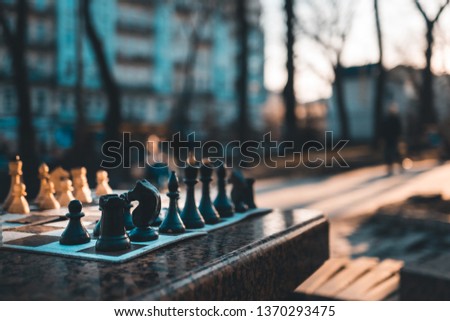chessboard desktop game on evening sunset street background