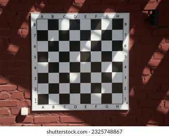 Chessboard on a brick wall