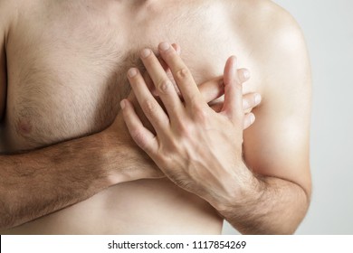 Chest Pain, Young Man Holding Hand To Spot Chest Pain