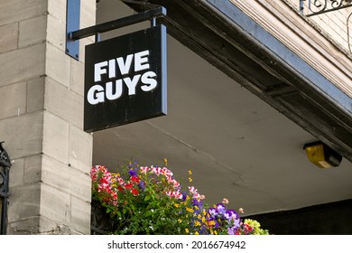 Chester, Cheshire, England - July 2021: Sign Above The Entrance To A Branch Of The Five Guys Fast Food Restaurant In The City Centre