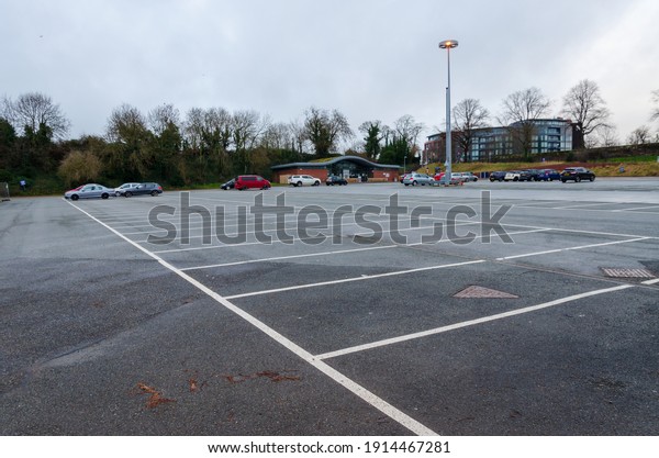 Chester; UK: Jan 29, 2021: The\
Little Roodee Car, coach and lorry park is very quiet on a damp\
Friday afternoon during lockdown due to the pandemic corona\
virus.