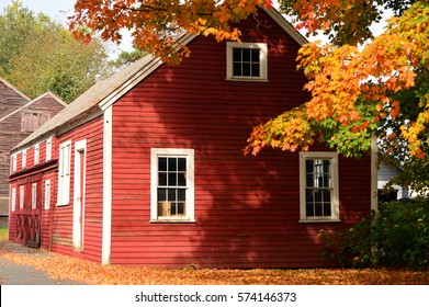 Chesterfield, NH, USA October 29 A red barn blends with the fiery New England autumn foliage in Chesterfield, New Hampshire