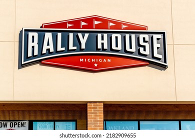 Chesterfield Twp., MI USA - October 5, 2020:  Horizontal, medium closeup of "Rally House" sporting gear apparel store's exterior facade brand and logo  signage on a bright sunny day with shadows.