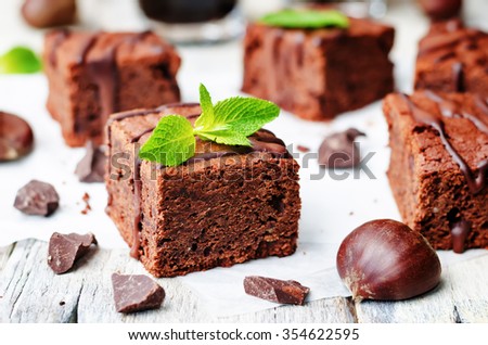 Similar – Chocolate brownie pieces on wooden background