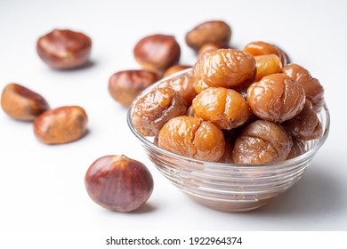 Chestnut dessert and chestnuts on a plate. Traditional delicious Turkish dessert; chestnut candies (Kestane Sekeri)