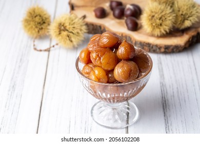Chestnut dessert and chestnuts on a plate. Traditional delicious Turkish dessert; chestnut candies (Kestane Sekeri)
