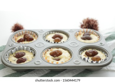 Chestnut And Dough In Muffin Mold For Home Bakery Image