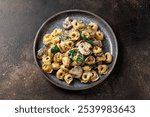 Chestnut Mushrooms and spinach tortellini served with parmesan cheese.