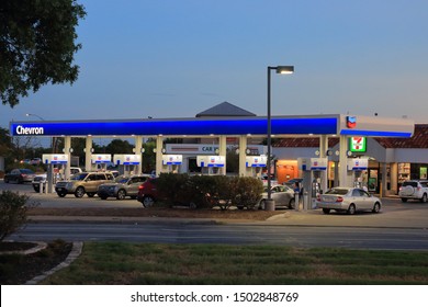 Chevron Branded Gas Station Illuminated At Dusk.  Chevron Corporation Is Publicly Traded Energy Company On The NYSE With Ticker Symbol CVX.  San Antonio, Texas, USA - September 12, 2019