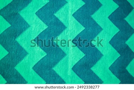 Chevron fabric pattern background. closeup of a patterned carpet or rug. dual tone geometric backdrop. Tribal style with traditional folk design. zigzag lines. Modern style wallpaper.