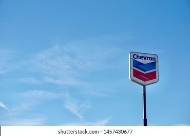 Chevron Logo Sign With Blue Sky Background        