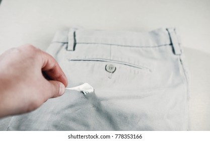 Chewing Gum Stuck To The Jeans Closeup, Removal Of Chewing Gum From Pants