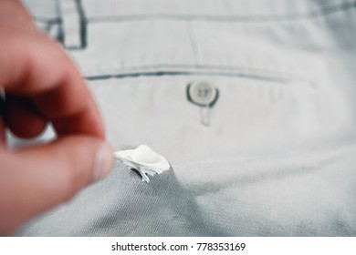 Chewing Gum Stuck To The Jeans Closeup, Removal Of Chewing Gum From Pants