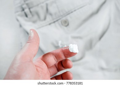 Chewing Gum Stuck To The Jeans Closeup, Removal Of Chewing Gum From Pants