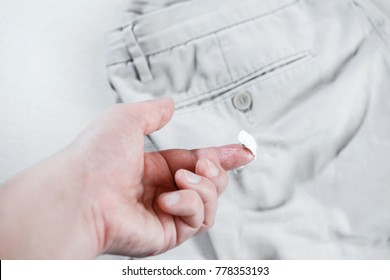 Chewing Gum Stuck To The Jeans Closeup, Removal Of Chewing Gum From Pants