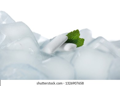 Chewing Gums And Mint On Ice Cubes Against White Background, Closeup