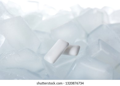 Chewing Gums On Ice Cubes Against White Background, Closeup