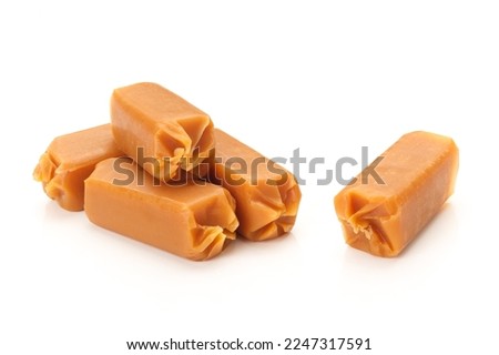 Chewy caramel or toffee candy on white