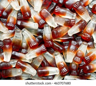 Chewy Cola Bottle Background A Popular Retro Sweet Also Known As Gummy Candy At A Pick And Mix Self Service Market.