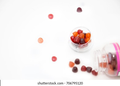 Chewy Gummy Multivitamins In A Bowl And A Spilled Bottle