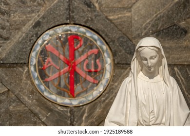 Chi Rho Or Labarum And A Statue Of Mother Mary, Maria At Basilica Of The Annunciation In Nazareth