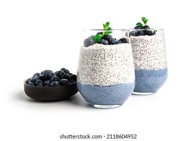 Chia pudding with blueberries isolated on white background. Chia pudding, mint and blueberries. High quality photo