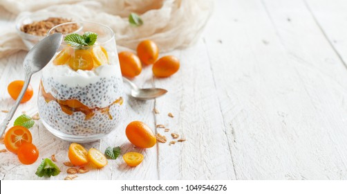Chia pudding parfait, layered with kumquat and granola
