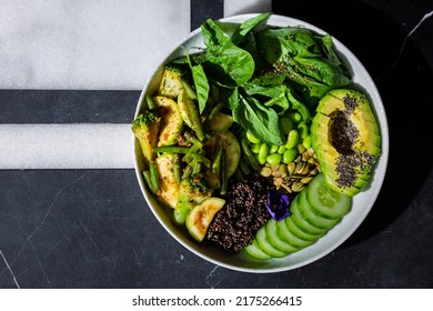 Chia Salad With Tomatoes, Broccoli, Basil, Broccoli, Zucchini, Cucumber, Asparagus Beans, Sesame Seeds, Watermelon Seeds, Avocado, Beans, Violet Flower In A Plate On A Background With A Letter