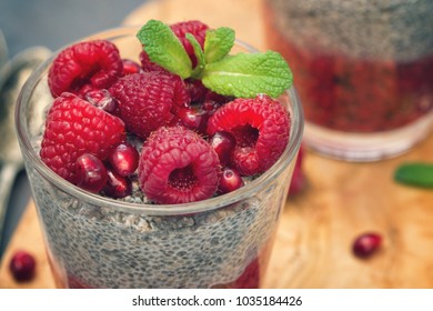 Chia seed pudding with fresh raspberries and pomegranates - Powered by Shutterstock