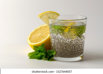 Chia Seeds Drink With Water In Glass With Lime Lemon Mint White Background