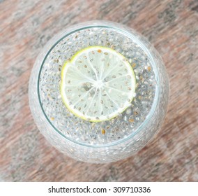 Chia Seeds Drink With Water And Lemon,  Wooden Background, Top View