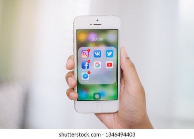 CHIANG MAI, THAILAND- 16 March 2019 :Hands of man use Iphone with applications of social media - Shutterstock ID 1346494403