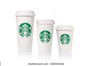 Chiang Mai, Thailand - 24 February 2018 - Starbucks coffee paper cups in 3 sizes, Tall, Grande, and Venti, are placed side by side on white background on February 24, 2018 in Chiang Mai, Thailand
