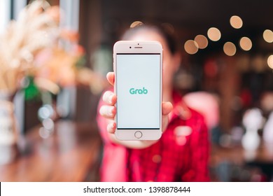 CHIANG MAI, THAILAND - Apr.08,2019: Woman holding Apple iPhone 6S Rose Gold with  Grab apps on screen. Grab is smartphone app all-in-one transport booking in South-East Asia. - Shutterstock ID 1398878444