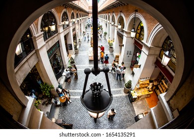 Chiang Mai/ Thailand- December 11, 2019:
Top View Of Vintage Style Building At One Nimman Mall With Many Tourists Walking Along The Walkway During Holiday. Fish Eye Lens Effect.