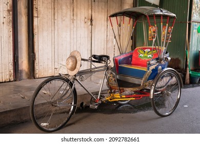 Chiang Mai, Thailand - December 14, 2021 : Thailand vintage retro tricycle bike or rickshaw parked in a corner of San Pa Koi Market, Chiang Mai, Thailand.