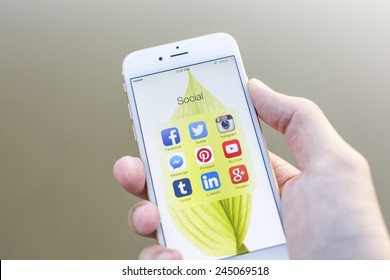CHIANG MAI, THAILAND - JANUARY 02, 2015: All of popular social media icons on smartphone device screen with hand holding on Apple iPhone 6. - Shutterstock ID 245069518