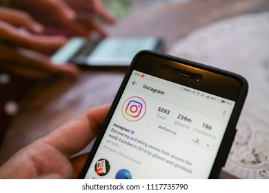 CHIANG MAI, THAILAND - JUN 20,2018: Woman holding Smartphone and using Instagram application on the screen.Instagram is largest and most popular photograph social networking.