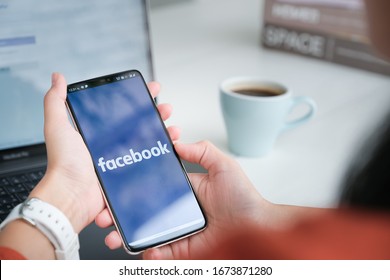 Chiang Mai Thailand. Mar  08, 2020. Woman Holds  Smart Phone With Facebook Application On The Screen. Facebook Is A Photo-sharing App For Smartphones